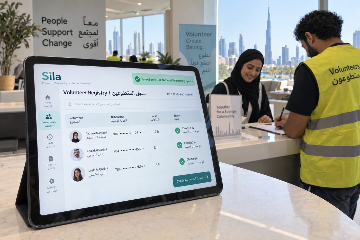 MOHRE-linked volunteer registry on a tablet at a UAE charity check-in desk showing bilingual hour tracking