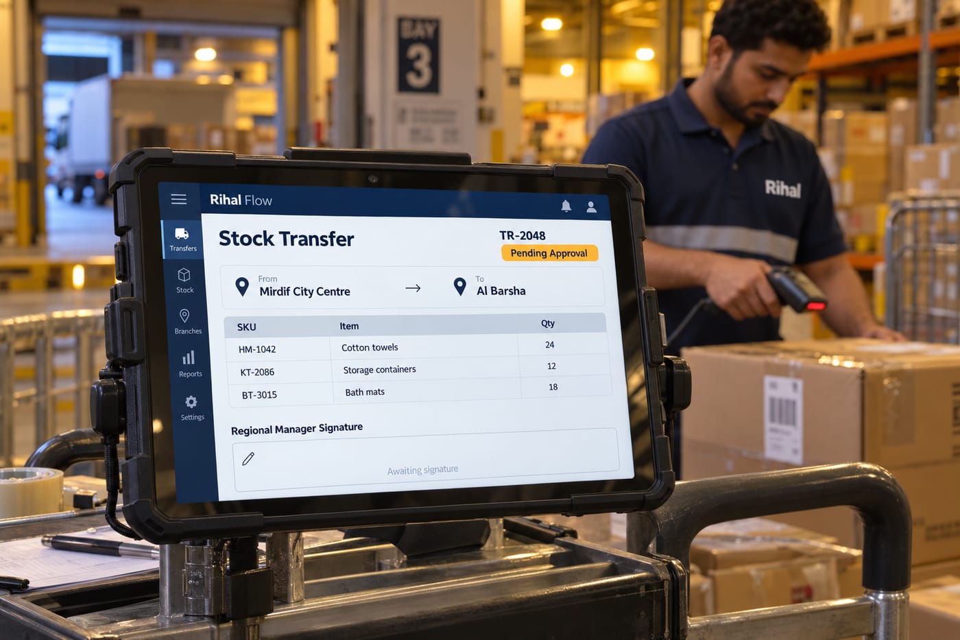 Stock transfer approval app on a tablet in a UAE retail warehouse, showing a branch-to-branch transfer request pending sign-off